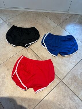 New 3-Pack Sports Shorts in Black, Blue & Red. 95% polyester 5% spandex.
